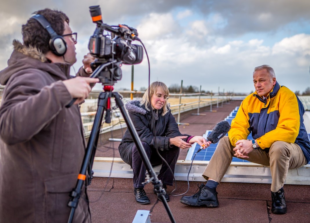 Marie interviewing on Kiln Farm community solar rooftop