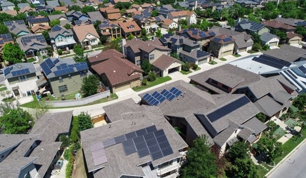 Community energy projects in Europe are demonstrated by community-owned solar PV in place on swathes of rooftops across cities