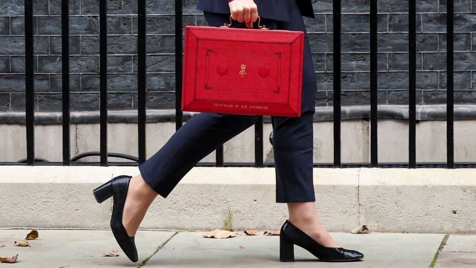 UK Chancellor carrying red briefcase