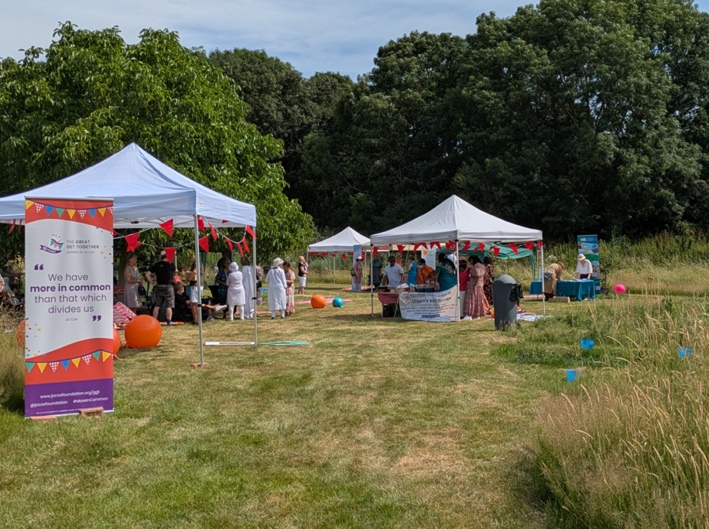 Great Get Together Community Picnic - Paddock area with stalls and picnic blankets